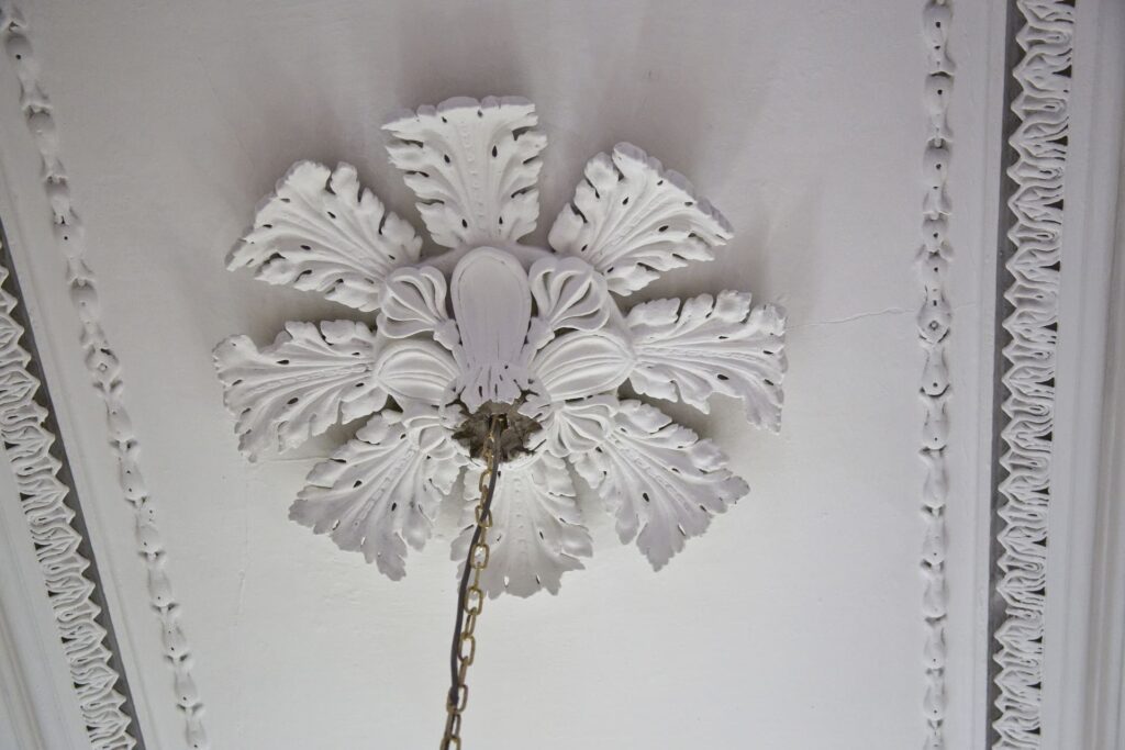 A close-up of a chandelier with crystal details.
